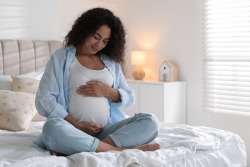 pregnant woman on bed