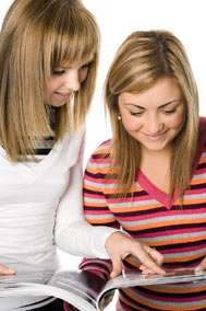Teen Girls Looking at Magazine