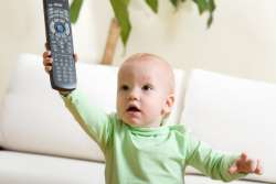 what is the right age, baby with TV remote