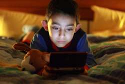 boy playing video game alone