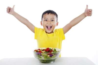 Child Eating Vegetables