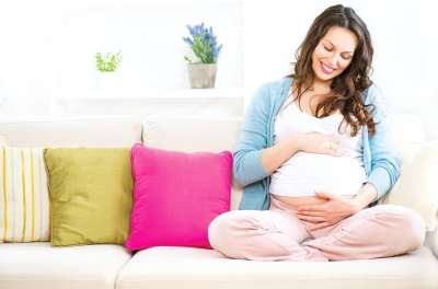 Pregnant Woman Sitting on Couch
