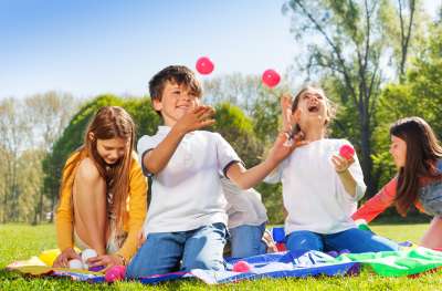 Children playing with colorful balls