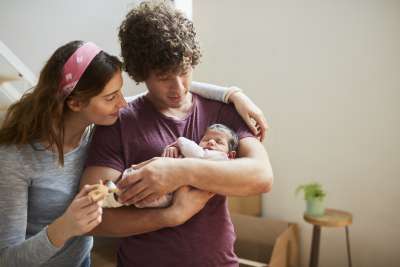 new parents bonding over a new baby