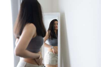teen girl worrying about her weight and appearance