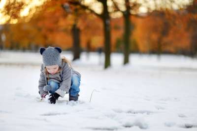 little girl playing on a snow day