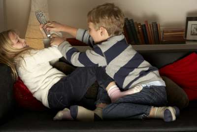 siblings fighting over the remote