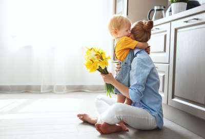 child giving mother a sweet gift for mother's day