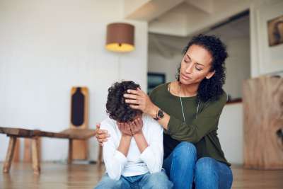 mom comforting kid with stress