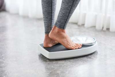 woman standing on scale