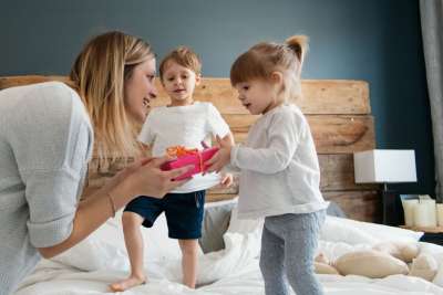 mom giving kids valentines day gifts