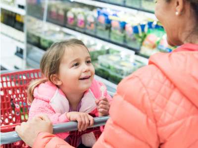 mom teaching daughter diversity lesson at target