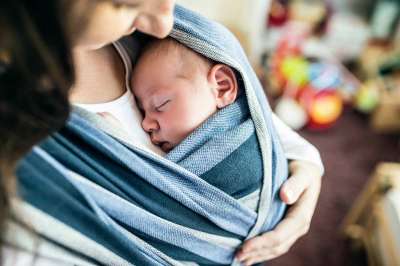 mom cradling baby on the left