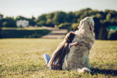Girl hugging her dog