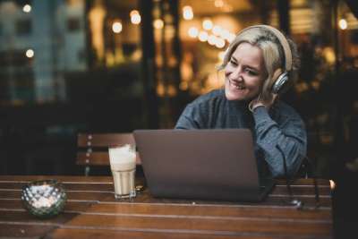 woman listening to genealogy podcast