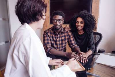 couple discussing the mthfr gene with doctor