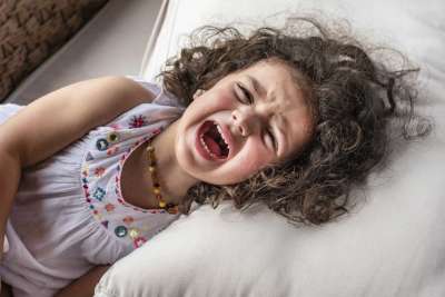 toddler girl facing big emotions, crying and screaming
