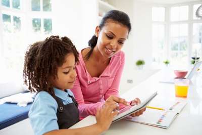 mom homeschooling her child