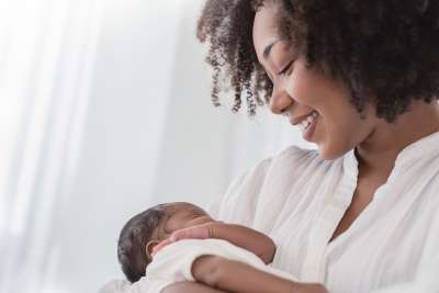 mother holding baby