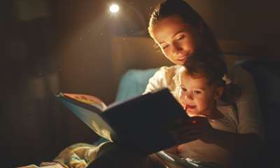 parent reading a book to child