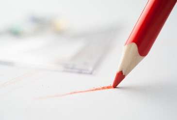 Red Pencil Writing on White Paper