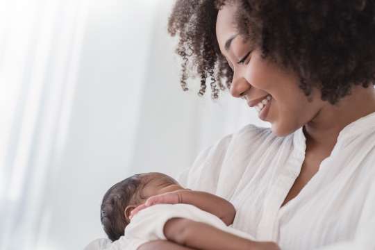 mother holding baby