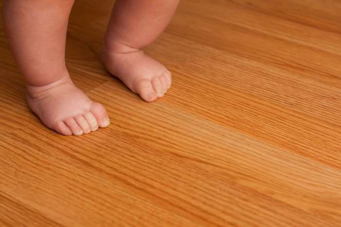 Baby Walking on Hardwood Floor