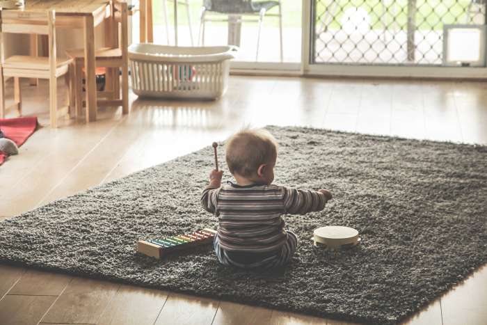A child playing instruments for National Music Week