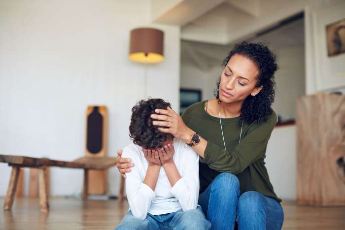 mom comforting kid with stress