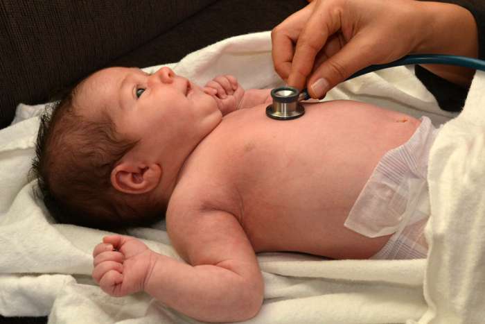Lady Checking Baby's Heartbeat - What Are Chances of Baby Receiving Cleft Palate
