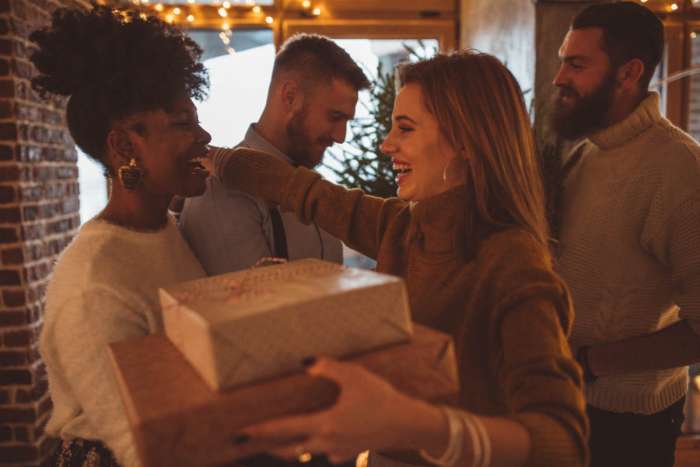 neighbors exchanging christmas gifts