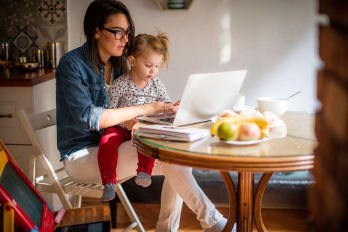 mom checking email with daughter