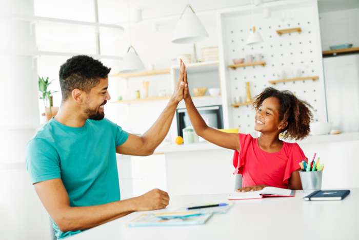 tutor giving student a high five