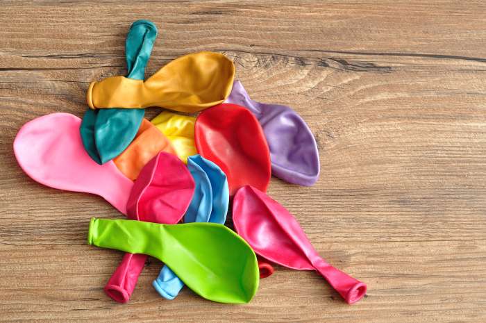 Use balloons to play indoor baseball