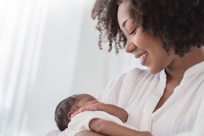 mother holding baby