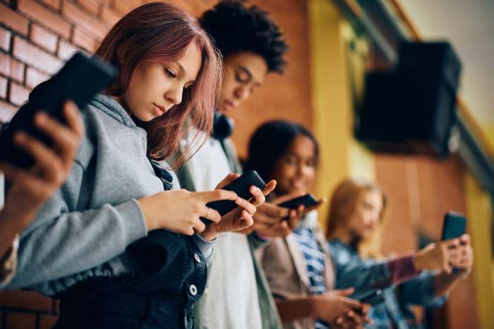 teenagers on their phones