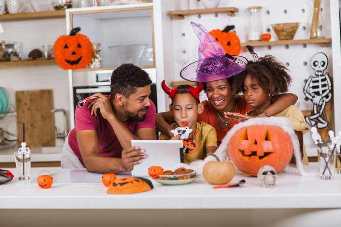Halloween - family looking at tablet