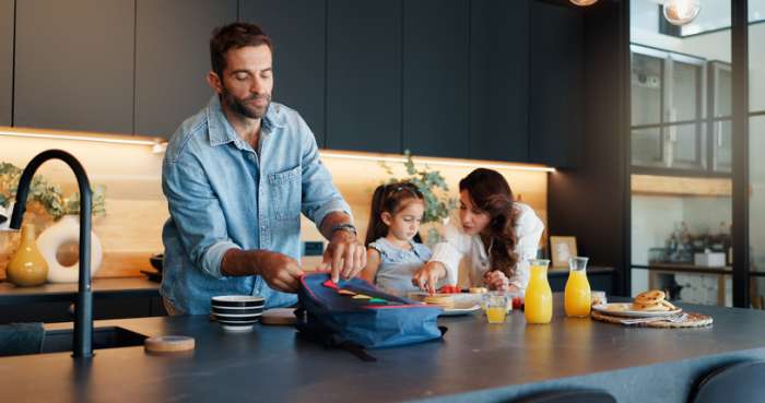 Getting ready for school eating breakfast