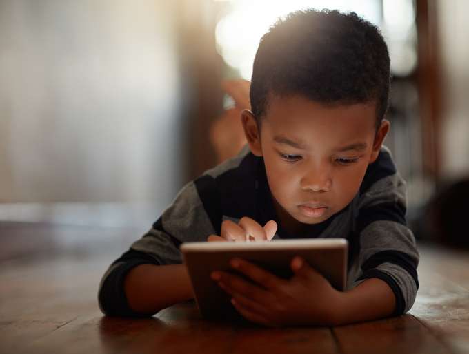 Kid on tablet