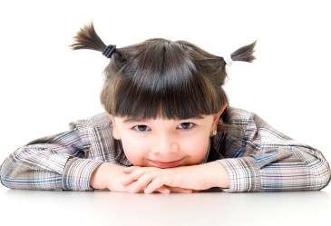 Close up of young girl looking at camera