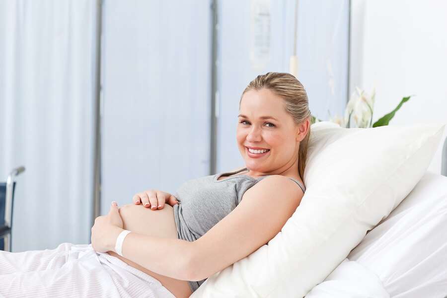 Happy Pregnant Women on Hospital Bed