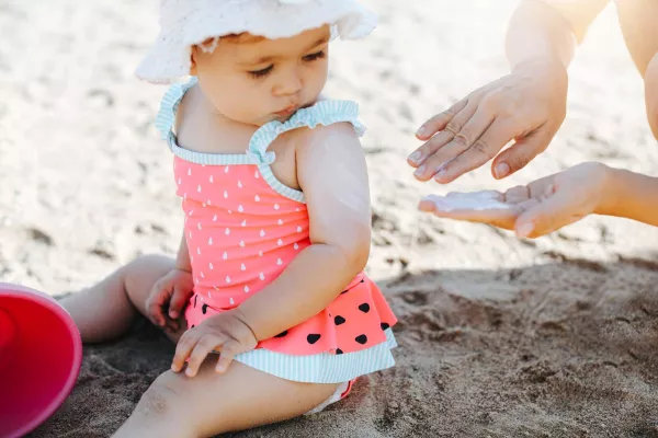 mom following sunscreen guidelines for babies