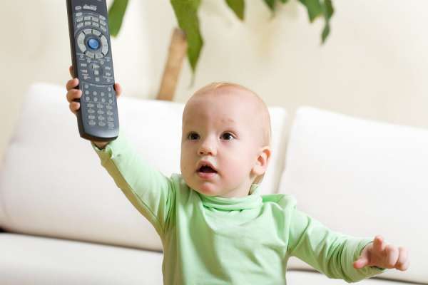 what is the right age, baby with TV remote
