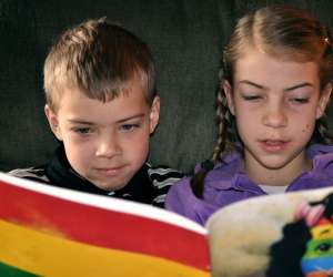 Two Kids Reading a Book