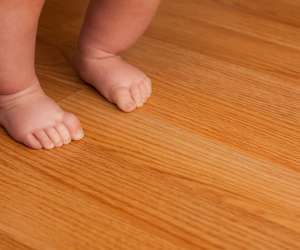 Baby Walking on Hardwood Floor