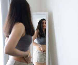 teen girl worrying about her weight and appearance