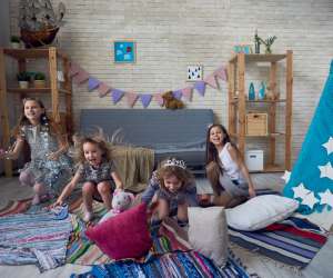 kids playing in an organized playroom