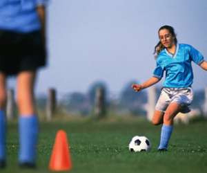 Girl teen playing soccer