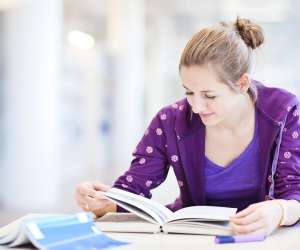 what colleges look for, female high school student studying for test