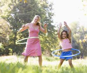 Fun Family Fitness, Mom and girl hula hooping outside for exercise